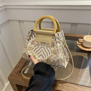 Retro embroidered bucket bag with wave patterns and resin handles for women