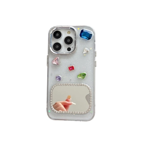Clear glitter iPhone case featuring colorful gemstones and a built-in makeup mirror