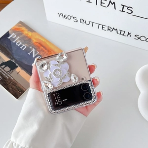 Macro view of crystal camellia and rhinestone inlay on transparent Samsung Z Flip 6 case