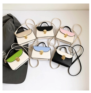 Detail showing various color options for the square handbag with gold metal twist locks