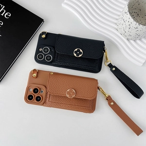 Detail of leather phone case with flower buckle card holder and detachable wrist strap