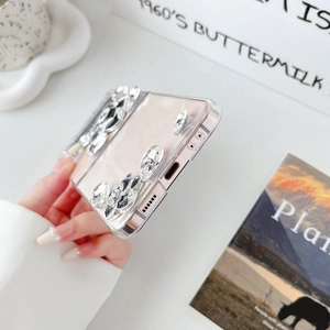 Macro detail of luxury Samsung Z Flip 6 clear case with sparkling rhinestones and floral accent