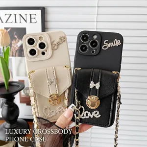 Chic iPhone wallet case with rhinestone bow, metal lock, and detachable crossbody chain strap