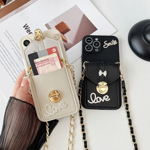 Crossbody wallet phone case with metal chain strap and sparkling rhinestone lettering
