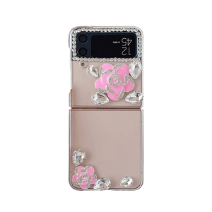 Luxurious Samsung Galaxy Z Flip clear case with pink enamel flowers and shiny rhinestones