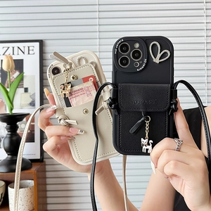 Detail of crossbody wallet phone case with card slot, long strap and cat charm for iPhone