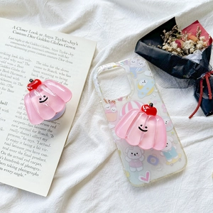 Detailed view of pink cherry jelly pop grip on a transparent phone case with cute dog art