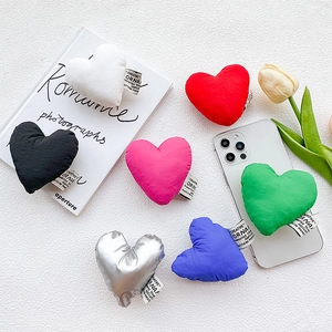 Plush heart-shaped folding phone sockets in seven vibrant colors on a white background