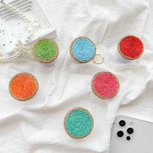 Close-up of colorful woven texture expandable pop socket phone grips in six bright shades