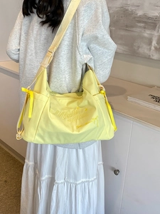 Stylish light yellow large capacity shoulder bag for women with chic ribbon details