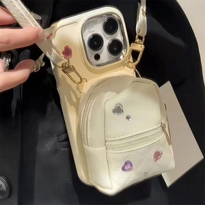 Crossbody iPhone case with a creamy white mini backpack wallet and heart rhinestones