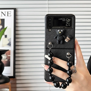 Black Samsung Z Flip 5 case with bear charm and thick glossy bead handle strap