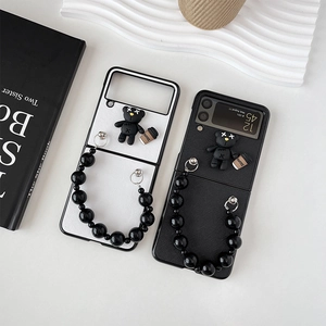 Samsung Galaxy Z Flip case with black bead chain and 3D bear coffee charm accessory
