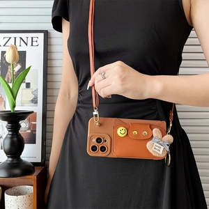 Brown leather crossbody phone case with card holder and cute rabbit charm detail