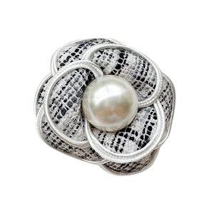 Elegant camellia phone grip featuring a large pearl and black and white tweed fabric