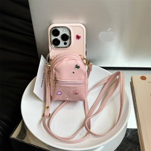 Pink leather iPhone crossbody case featuring a rhinestone mini backpack storage pouch