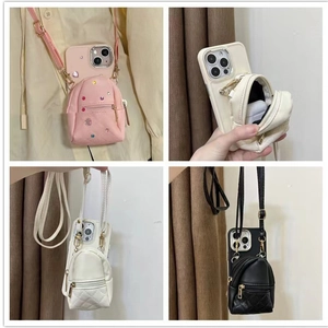 Crossbody phone case featuring a mini backpack coin purse and rhinestone detailing