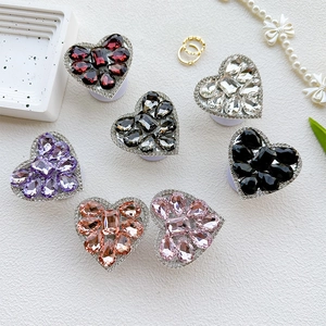 Close-up of heart-shaped luxury rhinestone phone sockets in seven vibrant colors