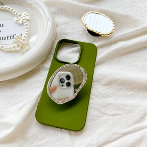 Detail of olive green silicone phone case with sparkling rhinestone mirror stand