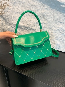 Vibrant green leather small square bag with white heart stitching and gold hardware