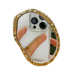 Irregular golden phone socket with hammered texture and reflective mirror surface