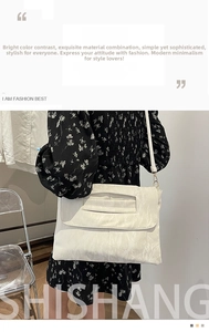Detail of off-white PU shoulder bag showing textured pleats and large flap closure