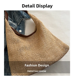 Close-up of hand-woven straw shoulder bag with durable brown leather trim detail