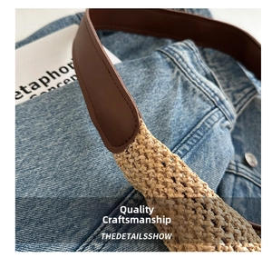 Macro shot of durable leather strap attachment on woven straw tote bag with fine textures