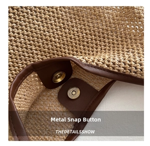 Close-up of straw woven bag featuring a brown leather trim and golden magnetic metal clasp