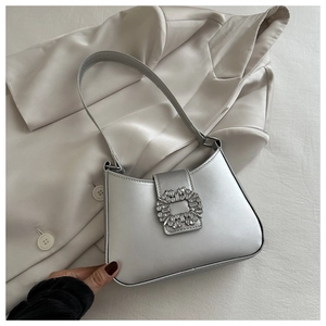 Chic silver metallic PU shoulder bag featuring a large rhinestone buckle and square design