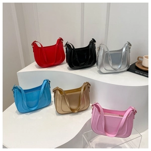 Detailed display of six vibrant glossy crescent bags in red, silver, blue, gold, and more
