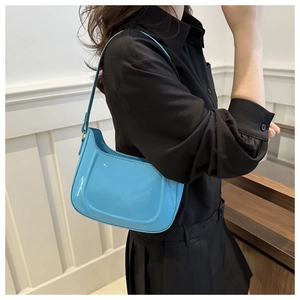 Sky blue glossy underarm bag with sleek minimalist design and shoulder strap