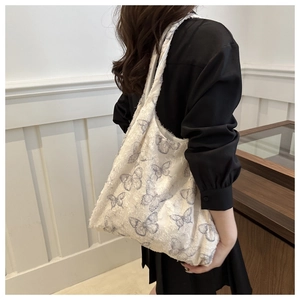 Lace butterfly print canvas tote bag featuring aesthetic blue patterns and long handles