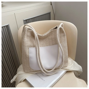 Close-up of beige woven tote bag with white pocket and rope handle on a chair