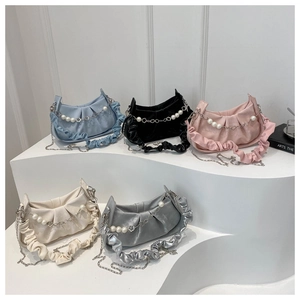 Detail of ruched crossbody bags in five colors with pearl and star chain straps