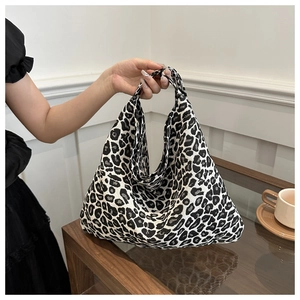 Close-up of large capacity leopard print tote bag in soft nylon fabric with handle
