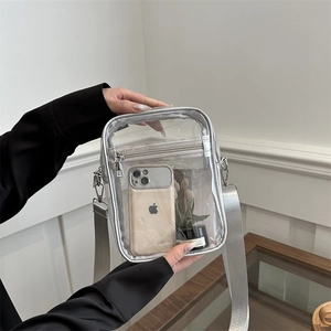 Transparent PVC crossbody bag with silver trim and adjustable shoulder strap