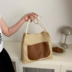 Minimalist woven straw tote bag with brown PU leather pocket and white cotton rope handles