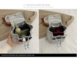 Detail showing inner storage of silver mini bucket bag with phone and umbrella