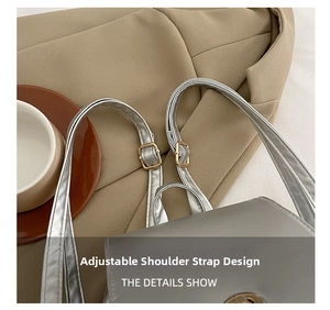 Detail of adjustable silver metallic PU backpack strap with golden metal buckle