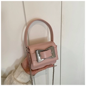 Detailed view of a pink mini crossbody bag featuring a large silver buckle and chain strap