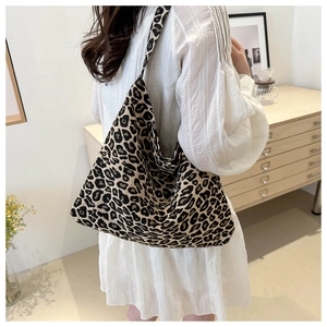Close-up of leopard print canvas tote bag showing high capacity and stylish textile texture