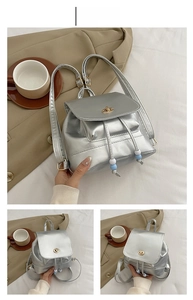 Detail view of silver mini backpack with drawstring closure and blue-white bead accents