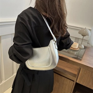 Silver metallic hobo shoulder bag for women with minimalist half-moon design and sleek finish