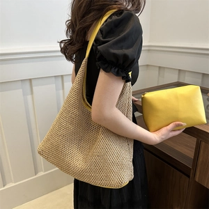 Fashionable beige woven hobo shoulder bag with yellow leather trim and matching inner pouch