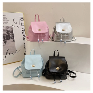 Chic mini PU leather backpacks in pink, silver, blue, and black with gold turn-lock