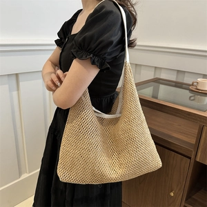 Women's woven straw shoulder bag with white strap for casual summer fashion