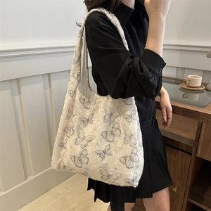 Floral butterfly canvas tote bag with textured fabric and tassels for women's fashion