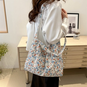 Floral canvas tote bag with blue and orange prints for casual shoulder wear