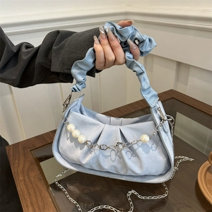 Minimalist light blue pleated crossbody bag featuring elegant pearl and flower chain